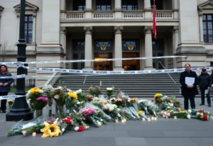 Memorial at the site of the Jewish Museum shooting with flowers and candles.